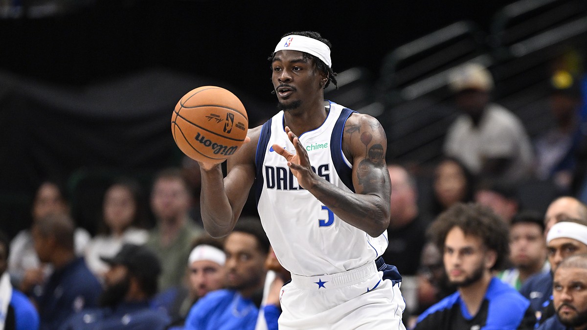 Dallas Mavericks forward Emanuel Miller catches a pass in front of the Dallas bench.