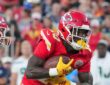 Kansas City Chiefs running back Emari Demercado tucks the ball and turns upfield at Arrowhead Stadium.