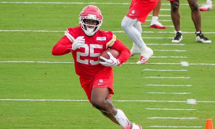 Kansas City Chiefs running back Emari Demercado carries the ball through a drill at training camp.