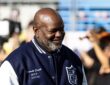 Former Dallas Cowboys running back Emmitt Smith wears his Super Bowl MVP jacket on the field before the game.