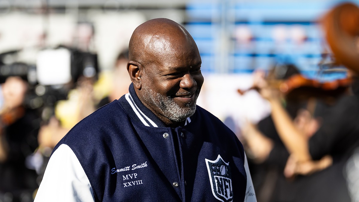 Former Dallas Cowboys running back Emmitt Smith wears his Super Bowl MVP jacket on the field before the game.