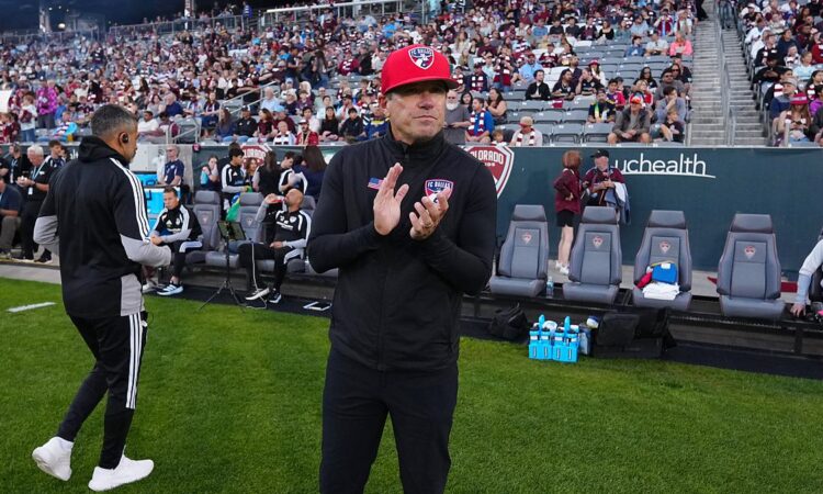 FC Dallas head coach Eric Quill applauds from the touchline before the match against the Colorado Rapids.