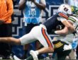 Auburn safety Eric Winters, No. 5, tackles Baylor tight end Matthew Klopfenstein short of the goal line.