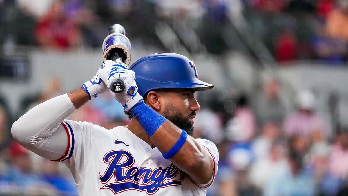 Texas Rangers shortstop Ezequiel Durán holds his bat while waiting on deck at Globe Life Field.