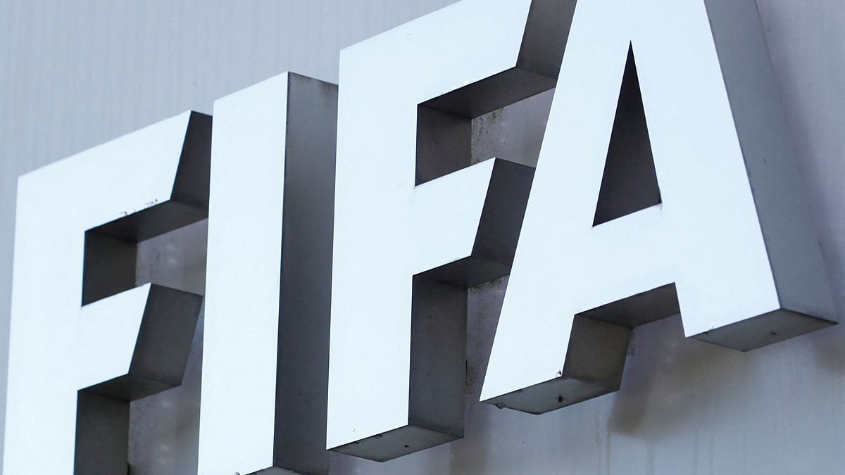 The white FIFA logo mounted on the gray exterior wall of the organization’s headquarters.