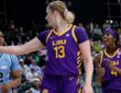 LSU Tigers guard Flau’jae Johnson, right, reacts as teammate Kate Koval points downcourt beside a Tulane defender.