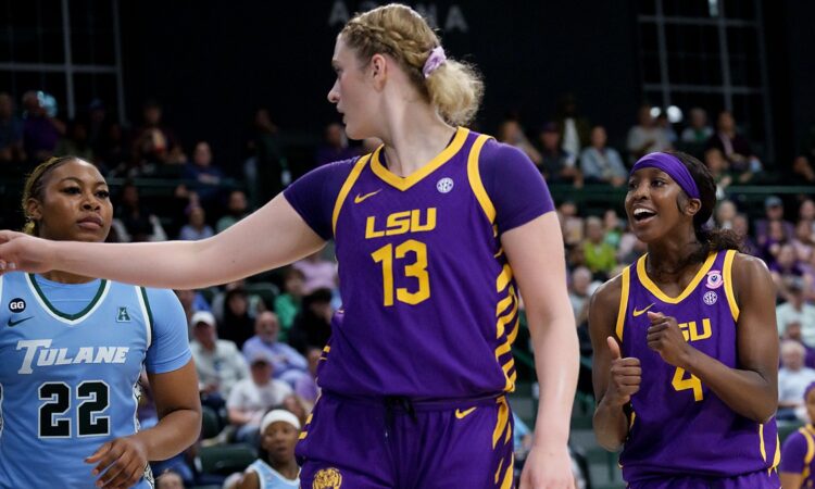 LSU Tigers guard Flau’jae Johnson, right, reacts as teammate Kate Koval points downcourt beside a Tulane defender.