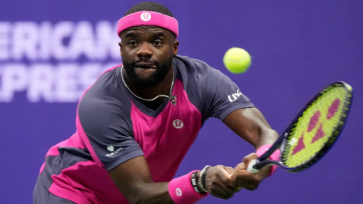 Frances Tiafoe tracks the ball into a two-handed backhand during a match.