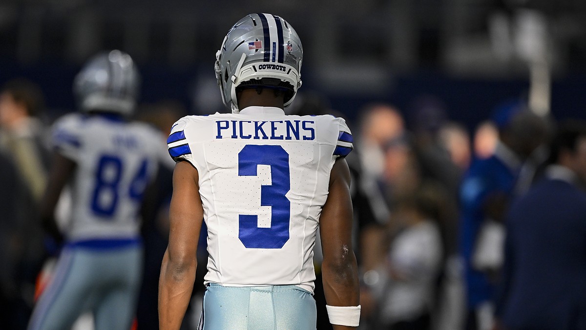 Dallas Cowboys wide receiver George Pickens stands with his back to the camera in his No. 3 jersey before kickoff.