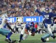 New York Giants tight end Isaiah Likely dives across the goal line as two Dallas Cowboys defenders close in.