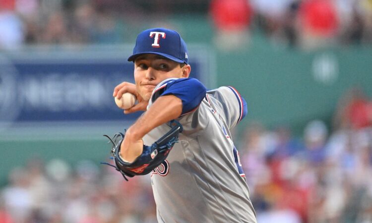 Texas Rangers starting pitcher Jack Leiter rears back to throw a pitch in his gray road uniform.