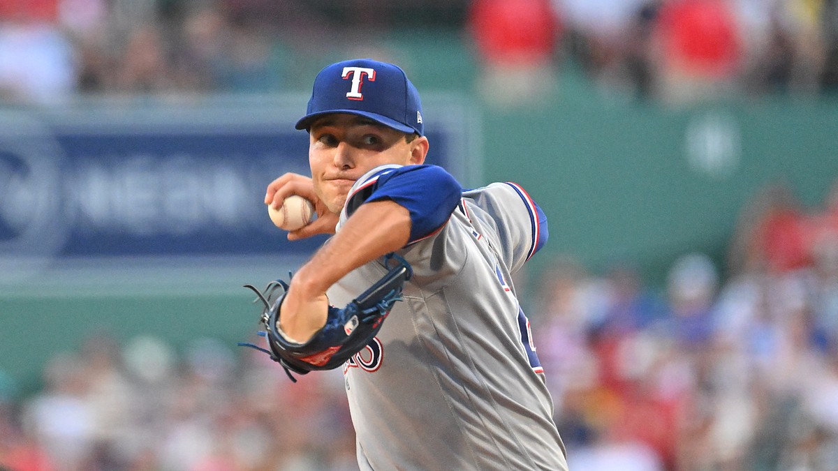Texas Rangers starting pitcher Jack Leiter rears back to throw a pitch in his gray road uniform.