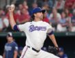 Texas Rangers right-hander Jacob deGrom, No. 48, brings his arm forward to deliver a pitch.