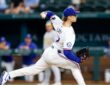 Texas Rangers left-hander Jacob Latz, No. 67, drives toward the plate mid-delivery.