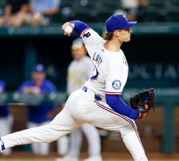 Texas Rangers left-hander Jacob Latz, No. 67, drives toward the plate mid-delivery.