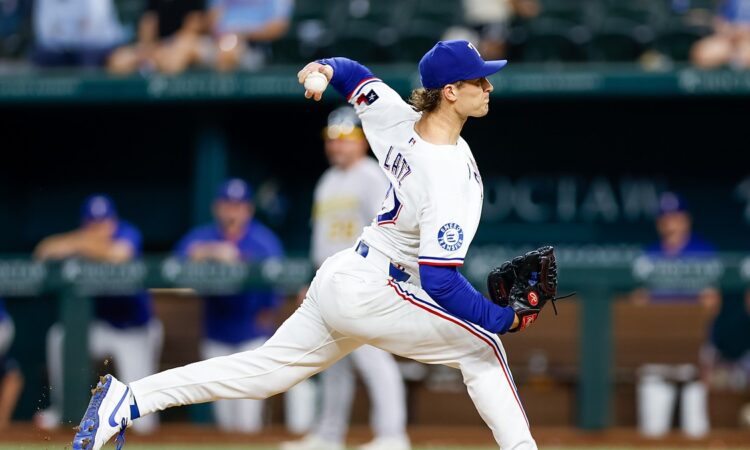 Texas Rangers left-hander Jacob Latz, No. 67, drives toward the plate mid-delivery.