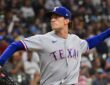 Texas Rangers left-hander Jacob Latz, No. 67, brings his arm back to deliver a pitch.