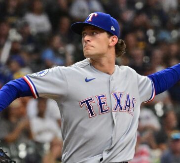 Texas Rangers left-hander Jacob Latz, No. 67, brings his arm back to deliver a pitch.