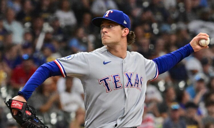 Texas Rangers left-hander Jacob Latz, No. 67, brings his arm back to deliver a pitch.