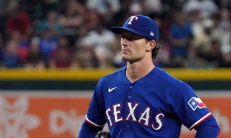 Texas Rangers pitcher Jacob Latz stands on the mound between pitches against Arizona at Chase Field.