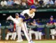Rangers pitcher Jacob Latz follows through off the mound with his back leg kicked high.