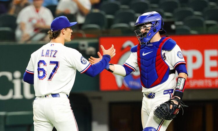 Rangers pitcher Jacob Latz shakes hands with his catcher on the mound after the final out.