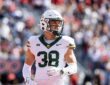 Baylor Bears safety Jacob Redding, No. 38, stands on the field in a white road uniform.