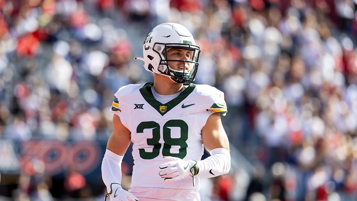Baylor Bears safety Jacob Redding, No. 38, stands on the field in a white road uniform.