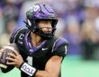 TCU quarterback Jaden Craig holds the ball at his chest and scans downfield during a rainy game.