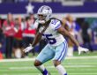 Cowboys linebacker Jaishawn Barham opens his hips and drops into coverage with both arms out.