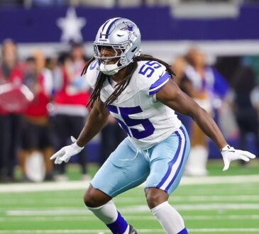 Cowboys linebacker Jaishawn Barham opens his hips and drops into coverage with both arms out.