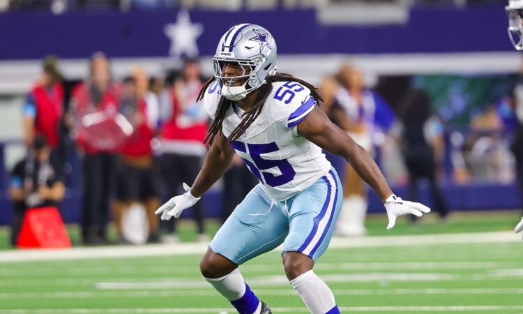 Cowboys linebacker Jaishawn Barham opens his hips and drops into coverage with both arms out.