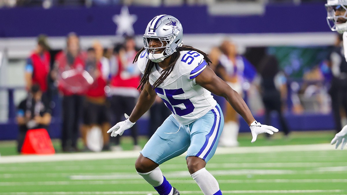 Cowboys linebacker Jaishawn Barham opens his hips and drops into coverage with both arms out.
