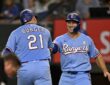 Texas Rangers first baseman Jake Burger and left fielder Wyatt Langford bump fists after Burger's second home run.