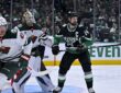 Stars left wing Jamie Benn sets up in front of the net as Wild goaltender Jesper Wallstedt tracks the play.