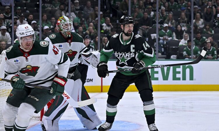 Stars left wing Jamie Benn sets up in front of the net as Wild goaltender Jesper Wallstedt tracks the play.