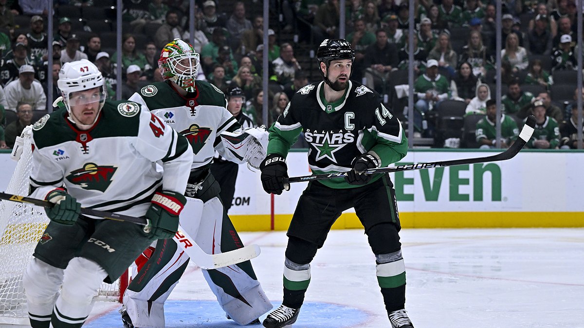 Stars left wing Jamie Benn sets up in front of the net as Wild goaltender Jesper Wallstedt tracks the play.