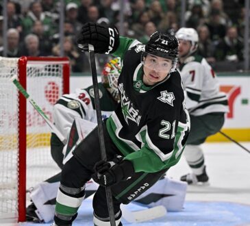 Dallas Stars left wing Jason Robertson turns up ice in front of the Minnesota net at American Airlines Center.