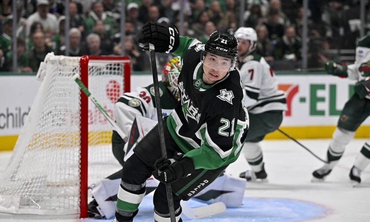 Dallas Stars left wing Jason Robertson turns up ice in front of the Minnesota net at American Airlines Center.
