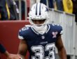 Dallas Cowboys running back Javonte Williams runs onto the field for warmups before facing the Commanders.