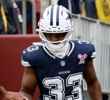 Dallas Cowboys running back Javonte Williams runs onto the field for warmups before facing the Commanders.