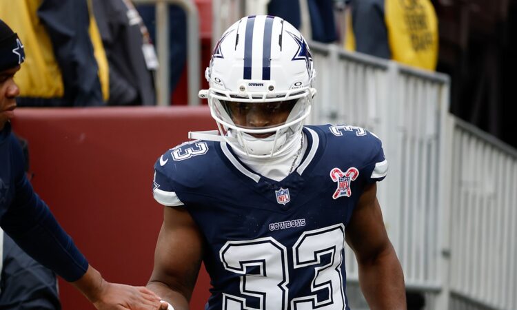 Dallas Cowboys running back Javonte Williams runs onto the field for warmups before facing the Commanders.