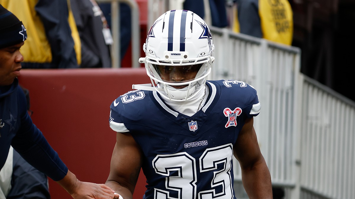 Dallas Cowboys running back Javonte Williams runs onto the field for warmups before facing the Commanders.