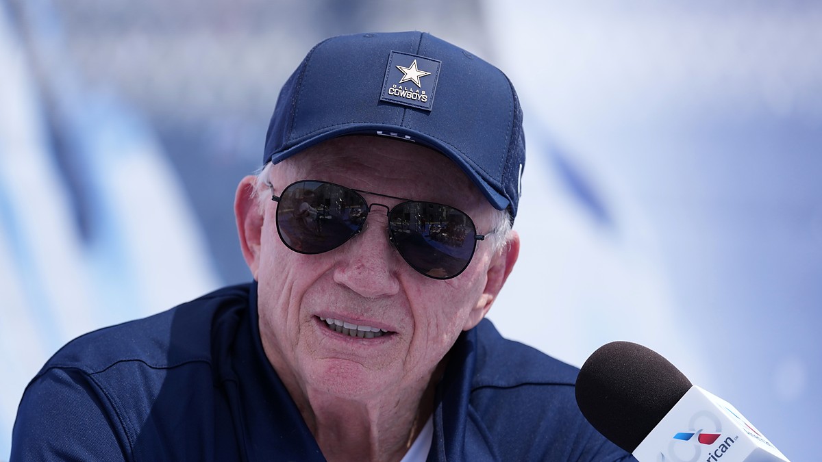 Dallas Cowboys owner Jerry Jones speaks into a microphone at the team's training camp opening press conference.