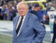 Cowboys owner Jerry Jones stands on the field with his hands on his hips before kickoff.
