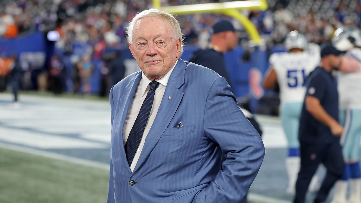 Cowboys owner Jerry Jones stands on the field with his hands on his hips before kickoff.