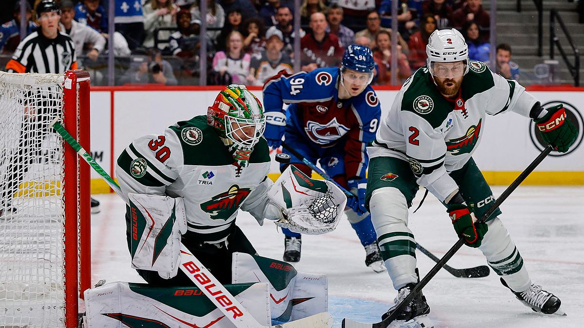 Wild goaltender Jesper Wallstedt stops a puck at the post as defenseman Jeff Petry clears the rebound.