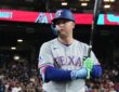 Texas Rangers designated hitter Joc Pederson holds his bat up as he waits to step in against Arizona.