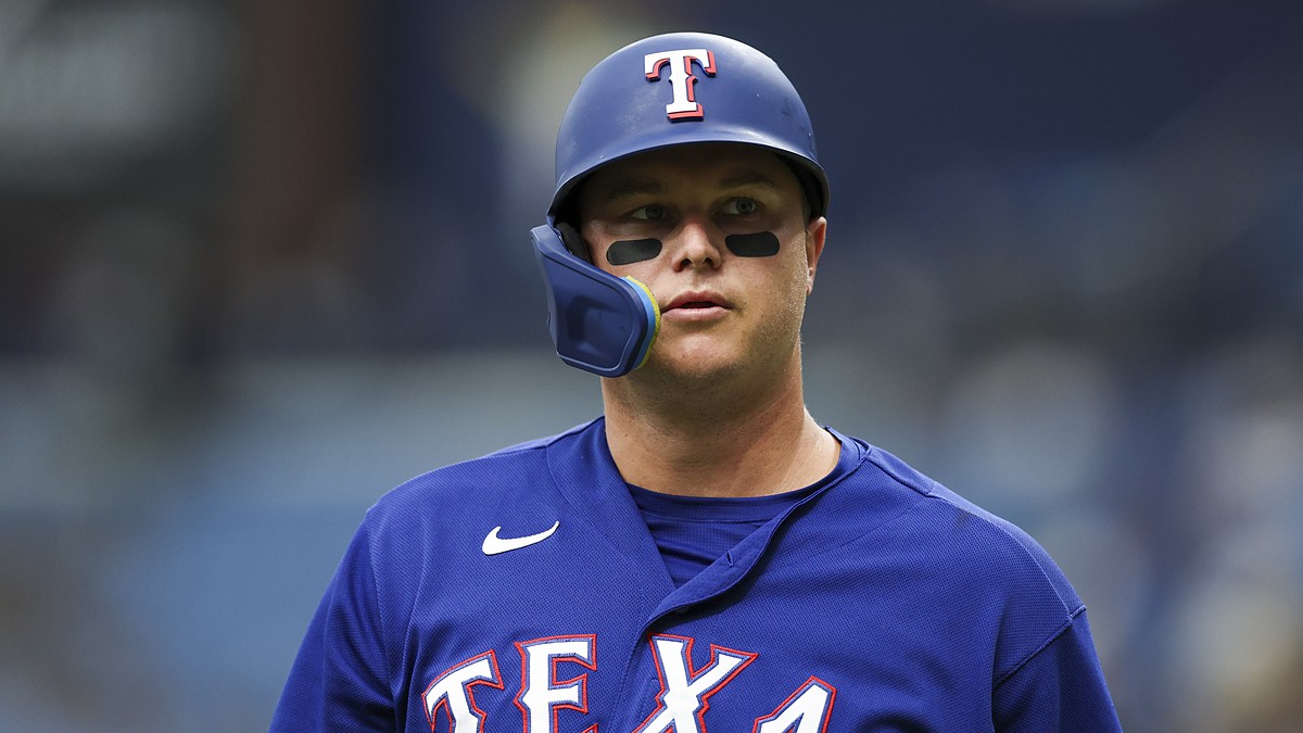 Rangers designated hitter Joc Pederson looks on in his batting helmet during the game against the Rays.