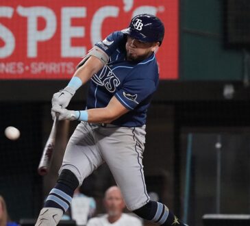 Tampa Bay Rays first baseman Jonathan Aranda, No. 8, drives a pitch with the ball off the barrel.